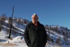 Ashcroft Indian Band Chief Greg Blain stands near burned trees in Ashcroft, B.C., on Jan. 10, 2022, part of an area that had previously been impacted by the 2017 Elephant Hill wildfire, which burned more than 190,000 hectares. (Photo by Aaron Hemens for the Globe and Mail)